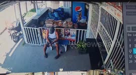 Window cover falls on man while sitting outside store