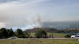 US: Planes Battle Through Smoke: Effort to Quell Broad Fire in Malibu