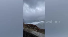 Large waves ripple on beach ahead of Typhoon Yinxing landfall in the Philippines