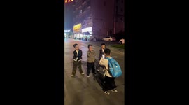 Three schoolboys pose for pop group style video