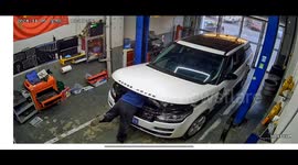 Mechanic injured after car's hood slams shut on his back