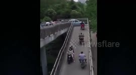 Car drives onto pedestrian bridge and nearly gets stuck