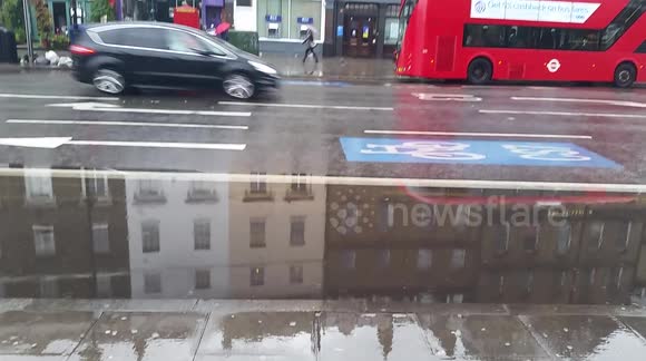 Bus lanes flooded in Clapham, London after major overnight storms
