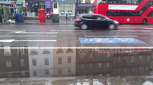 Bus lanes flooded in Clapham, London after major overnight storms