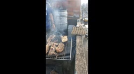 Dog peers through terrace during barbecue in Bogotá, Colombia