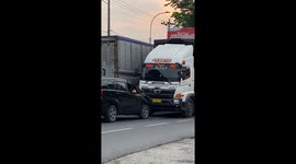 Road Rage in Indonesia as truck pushes wrong-way car