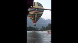 Hot air balloon narrowly avoids crashing into lake