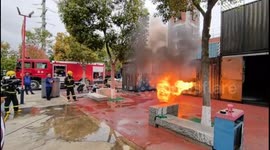 Chinese firefighters use water shield to combat blaze