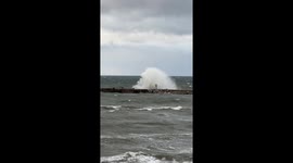 OMG! The man is covered with a wave!