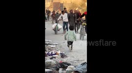Gaza Strip: A child is reunited with his father after five hours in Israeli army custody during the evacuation from the Beit Lahia project area