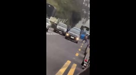 Police engage in gunfire with hooded criminals on roadside