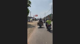 Dog on a leash with a scooter driver caused a road accident in Indonesia