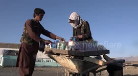 Afghan children struggle for a bite of bread despite cessation of conflict