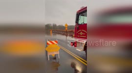 Driver ignores warnings and gets stuck on flooded road in California