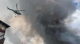 Firemen battle huge fire ripping through slum homes in the Philippines