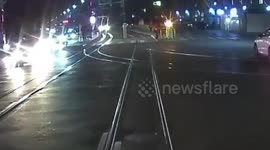 Teen narrowly avoids being crushed by tram after hugging girl and running across tracks without looking