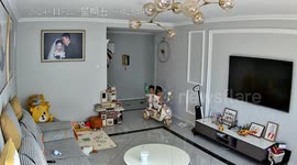 Brother and sister topple over while riding toy car