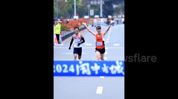 Chinese runner celebrates too early and is pipped to finish line by ...