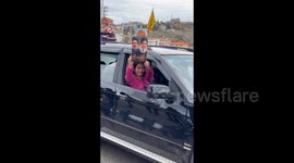 Lebanon: People on the roads of Lebanon drive with flags and banners from the windows of their cars
