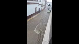Flooded street sweeps away woodcraft in Bollullos, Spain