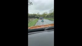 Mobility scooter rider splashed by passing vehicle in Bedford, UK
