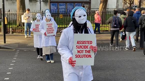 Protesters opposed to the Assisted Dying Bill gather outside the parliament in London