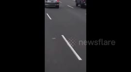Argentina: A woman drove with the hood up on a highway in Buenos Aires