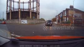 A Car pulls out from a one way street facing the wrong direction