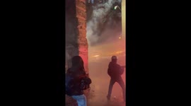 Protesters in Tbilisi fire fireworks using machine gun-like device