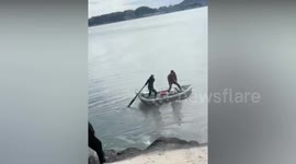 Moment fishermen are swept away by strong tide after jumping from dinghy