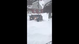 National Guard tries to free vehicle stuck in deep snow in Erie, Pennsylvania, USA