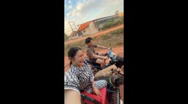 Pet dogs ride in motorcycle sidecar with family