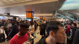 Travelers stopped at the Rome Termini station waiting to be able to catch a train while the boards signal severe delays in train departures and arrivals due to a technical fault at the Termini and Tiburtina railway stations in Rome.