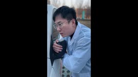 Driver humorously tends to his car like a doctor to their patient