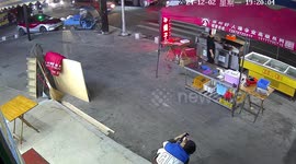 Surveillance video captures car hitting motorcycle in Wenzhou, China