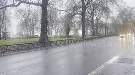 Traffic on Park Lane, London during storm Darragh