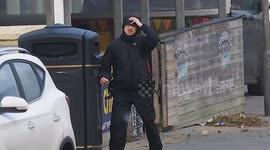 Storm Darragh blows pedestrians all over the high street, Newquay, Cornwall, UK