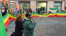 An Ethiopian activist of Amhara ethnicity speaks into a microphone to other participants during the sit-in to denounce the persecution of the Amhara people in Ethiopia, in Rome.