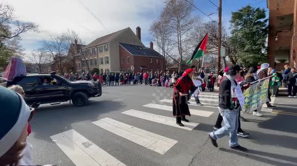 Palestinian American Friendship & Cultural Association members walking in the 53rd Annual Alexandria, Virginia USA Scottish Christmas Walk Parade