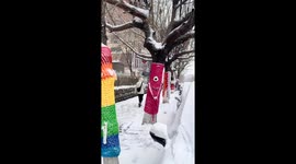 Trees wearing colorful knitted sweaters in Jilin, China