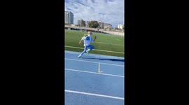The video showcases the process of preparing for a run at the stadium. A girl performs warm-up and specialized exercises to get her muscles ready, followed by a short running sequence. The quick transitions between dynamic shots capture the energy and foc