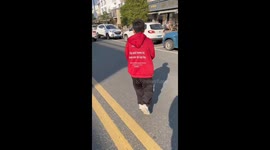 Rescuers save frightened yellow weasel in China