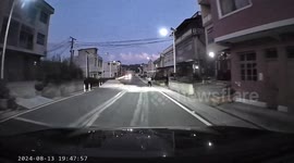 Car crashes into sand pile on road in China