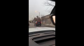 Electrical conduit rolls in the middle of the road in Chicago, Illinois, USA