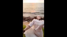 Chinese tourist posing for video by hanging from train door is hit by tree branch