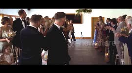 Little boy beats odds to walk mum down aisle thanks to special harness