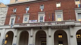 A banner with the slogan ‘free to demonstrate’ is displayed on the facade of the Confederal Chamber of Labor, headquarters of the CGIL union in Bologna.