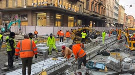 Workers at work on one of the construction sites of the Bologna tram network.