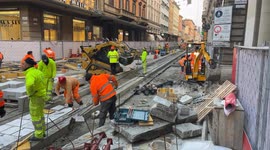 Workers at work on one of the construction sites of the Bologna tram network.