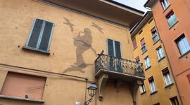 The mural depicting the shadow of Lucio Dalla playing the saxophone surrounded by seagulls on the Tremiti Islands on the facade of Lucio Dalla's house in Bologna.